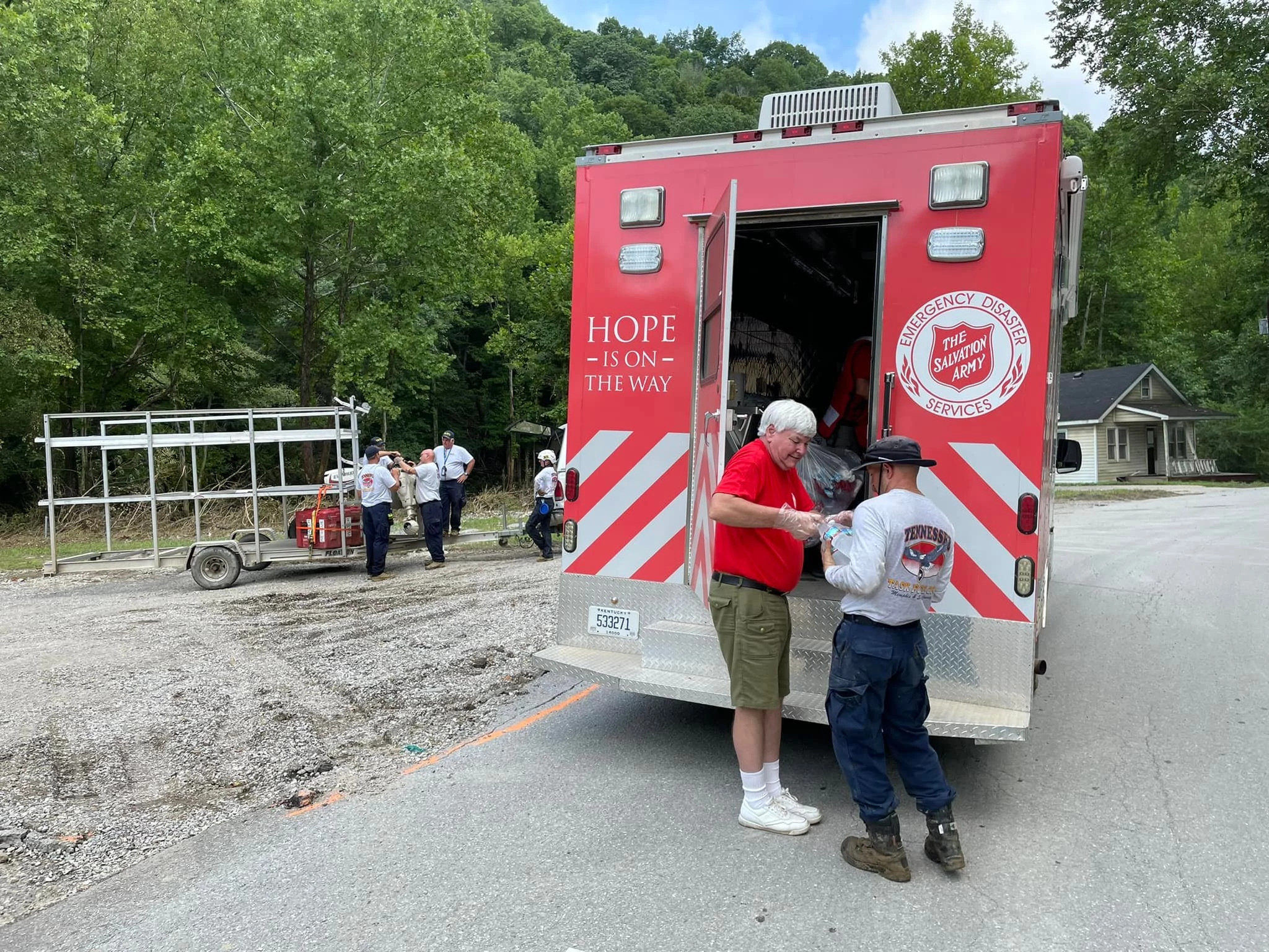 A Salvation Army volunteer hands out supplies
