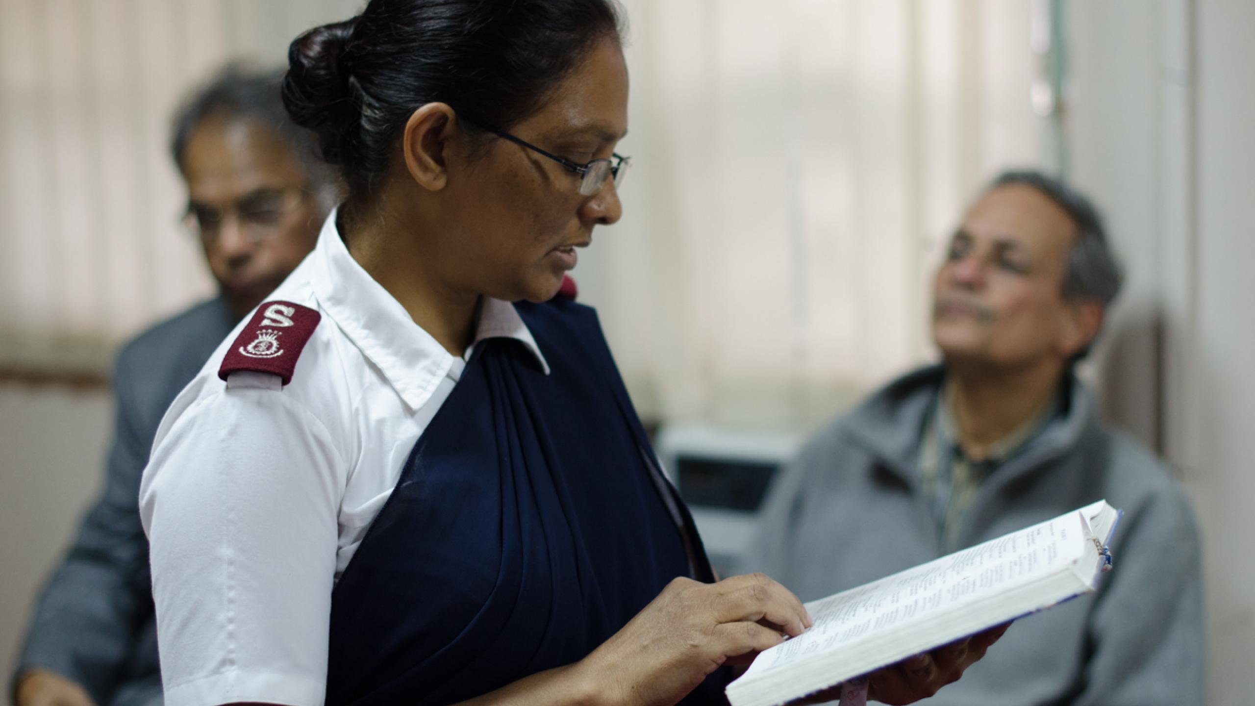 An Indian Salvation Army officer reading the Bible