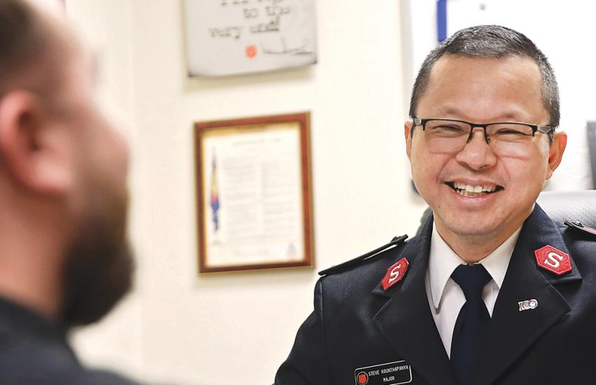 A Salvation Army officer in conversation with someone