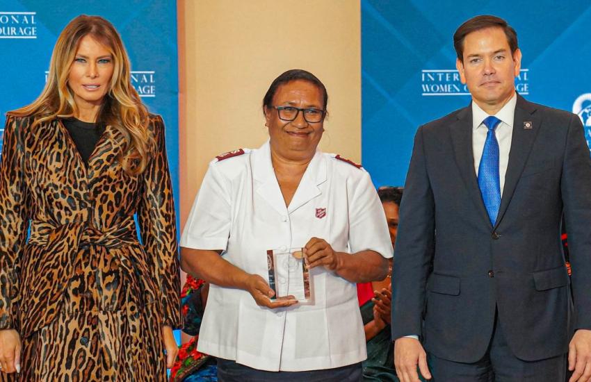 Major Velena Iga (centre) with her award, alongside Melania Trump and Marco Rubio