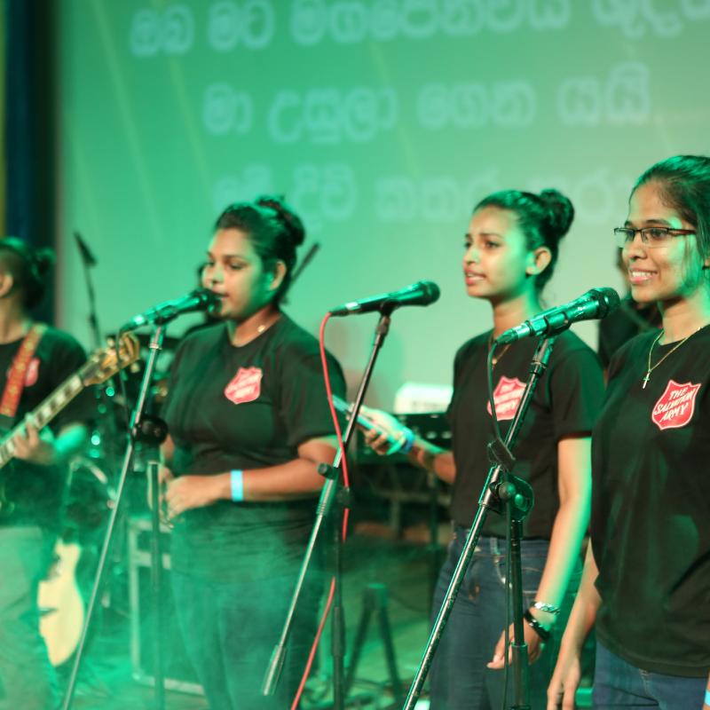 A worship band wearing Salvation Army t-shirts